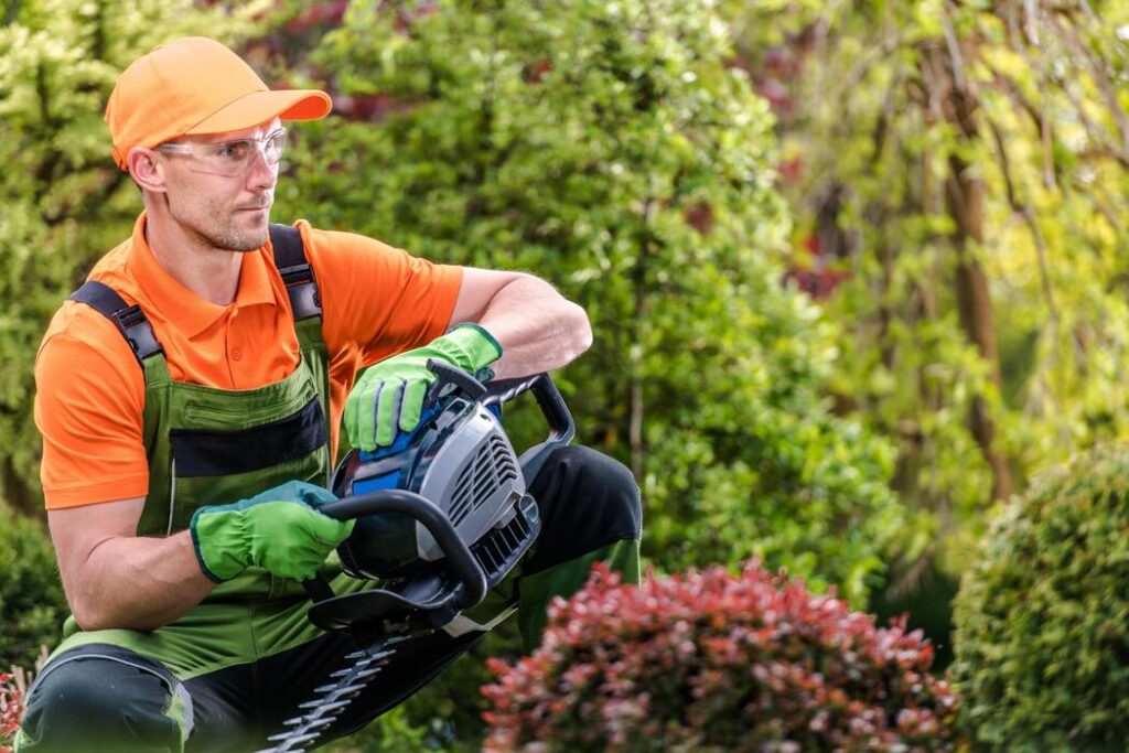 garden worker with trimmer photo